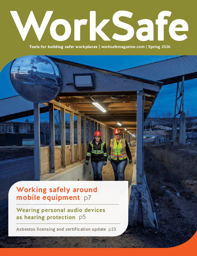 Cover with photo on semi-dark construction site with two workers wearomg hi-vis clothing and hard hats.